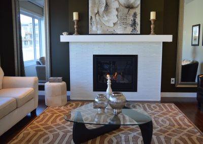Coffee table in front of fireplace
